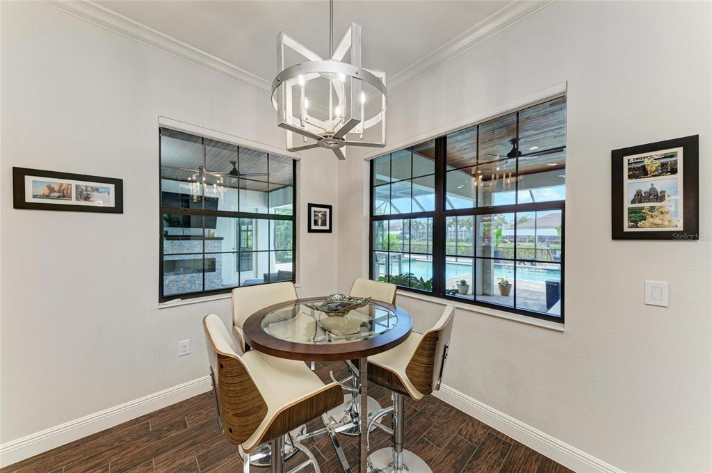 544 Fore Drive Bradenton, FL 34208 - Photo 25 of 95 a view of a dining room with furniture large window and wooden floor