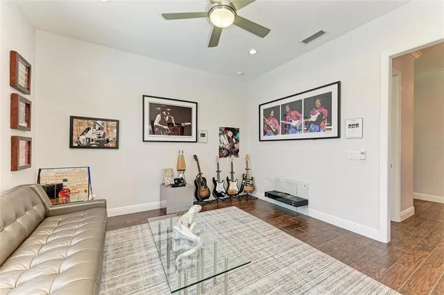 a large white kitchen with stainless steel appliances granite countertop a refrigerator and a stove top oven
