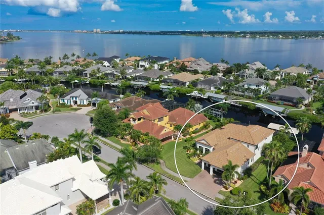 an aerial view of a house with swimming pool patio and outdoor seating