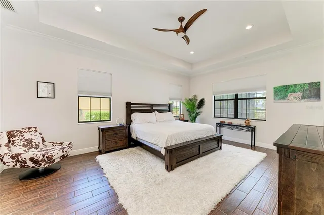 a spacious bedroom with a bed and a large window