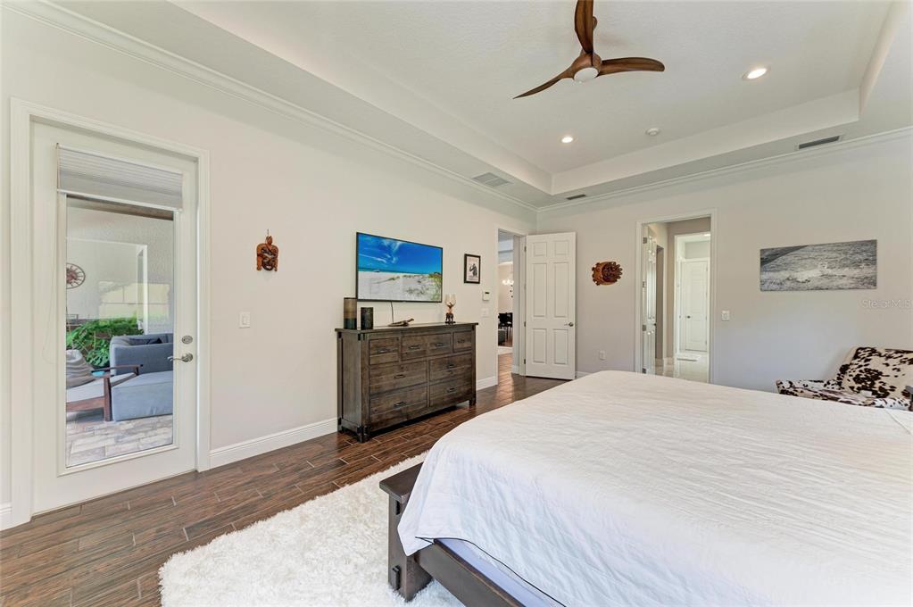 544 Fore Drive Bradenton, FL 34208 - Photo 35 of 95 a spacious bedroom with a bed and a dresser