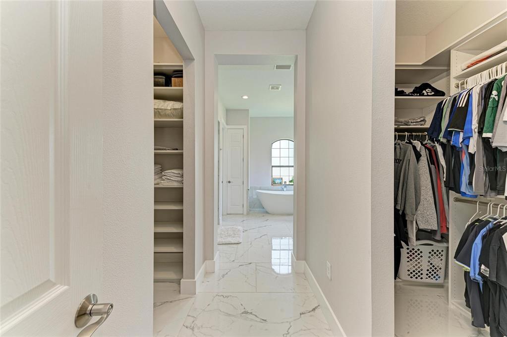 544 Fore Drive Bradenton, FL 34208 - Photo 36 of 95 a view of walk in closet with clothes and shoes