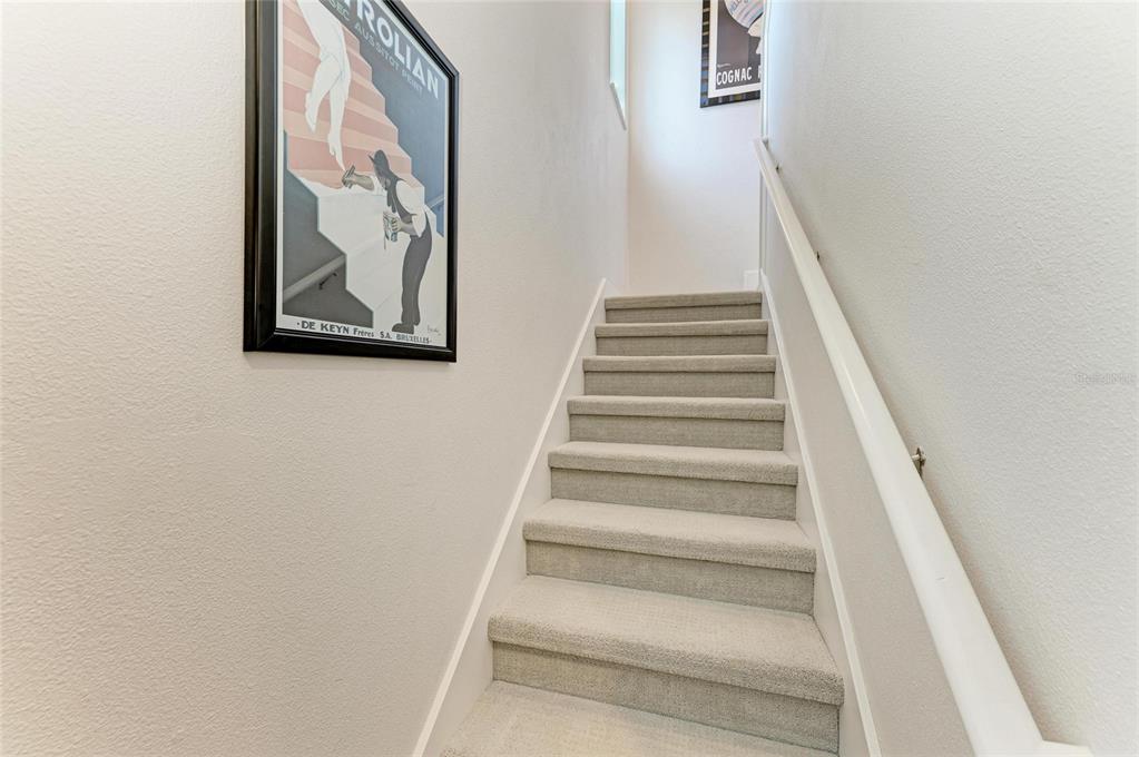 544 Fore Drive Bradenton, FL 34208 - Photo 43 of 95 a view of staircase with wooden floor and white walls
