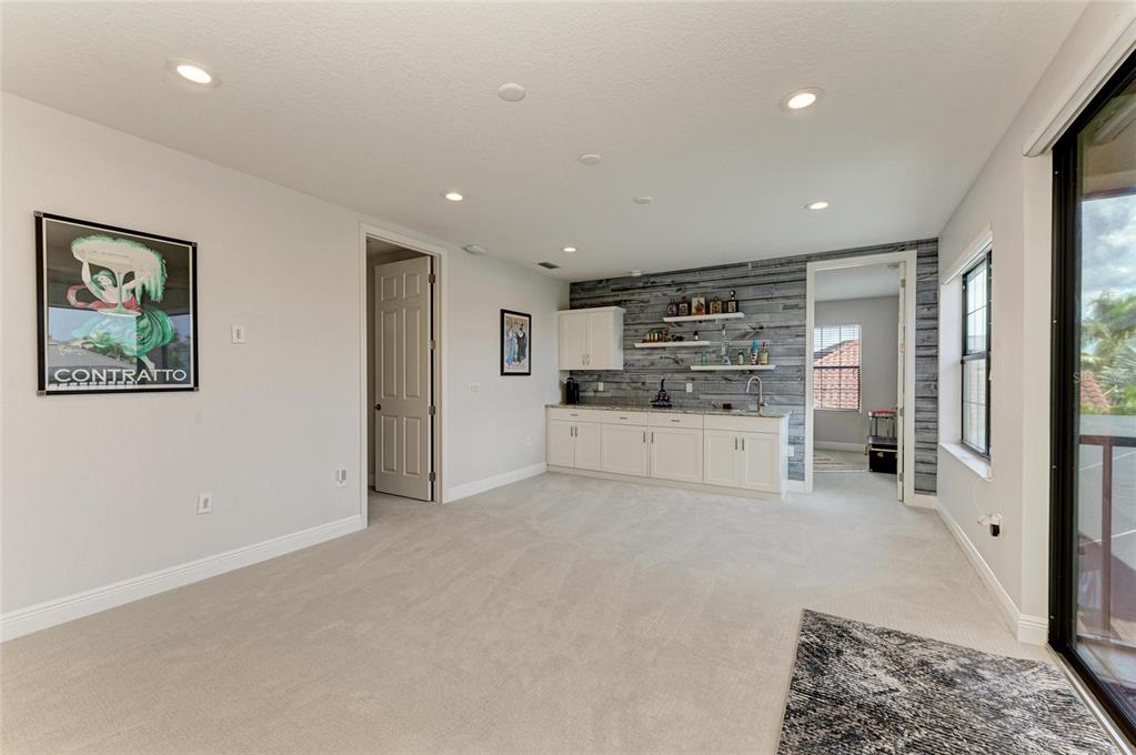 544 Fore Drive Bradenton, FL 34208 - Photo 45 of 95 a large white kitchen with stainless steel appliances granite countertop a refrigerator and a stove top oven