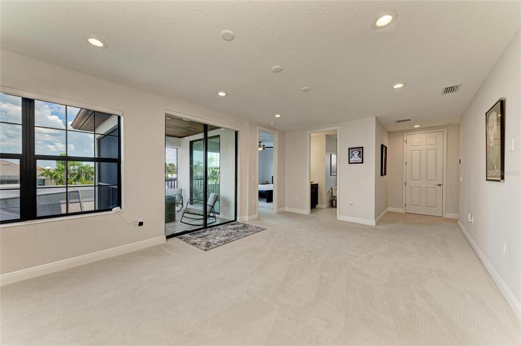544 Fore Drive Bradenton, FL 34208 - Photo 47 of 95 a view of an empty room with glass door and windows