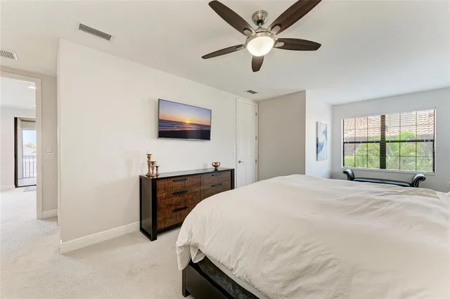 an aerial view of a house with a garden and lake view