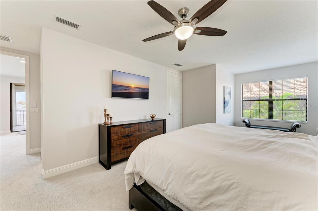 544 Fore Drive Bradenton, FL 34208 - Photo 50 of 95 a bedroom with a bed and a flat screen tv