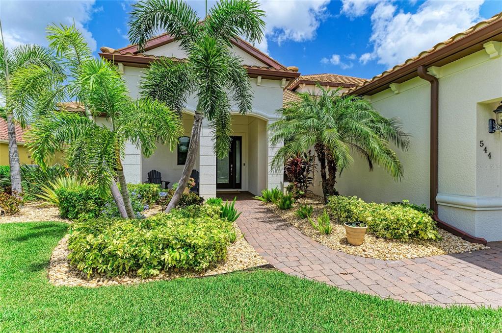 544 Fore Drive Bradenton, FL 34208 - Photo 5 of 95 a front view of a house with garden