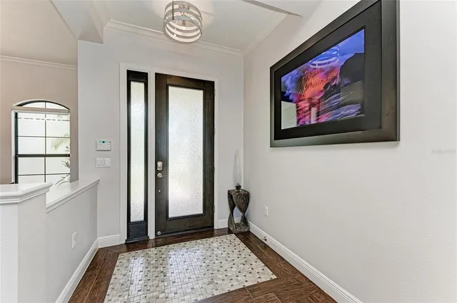 a living room with couches a fireplace and a large window