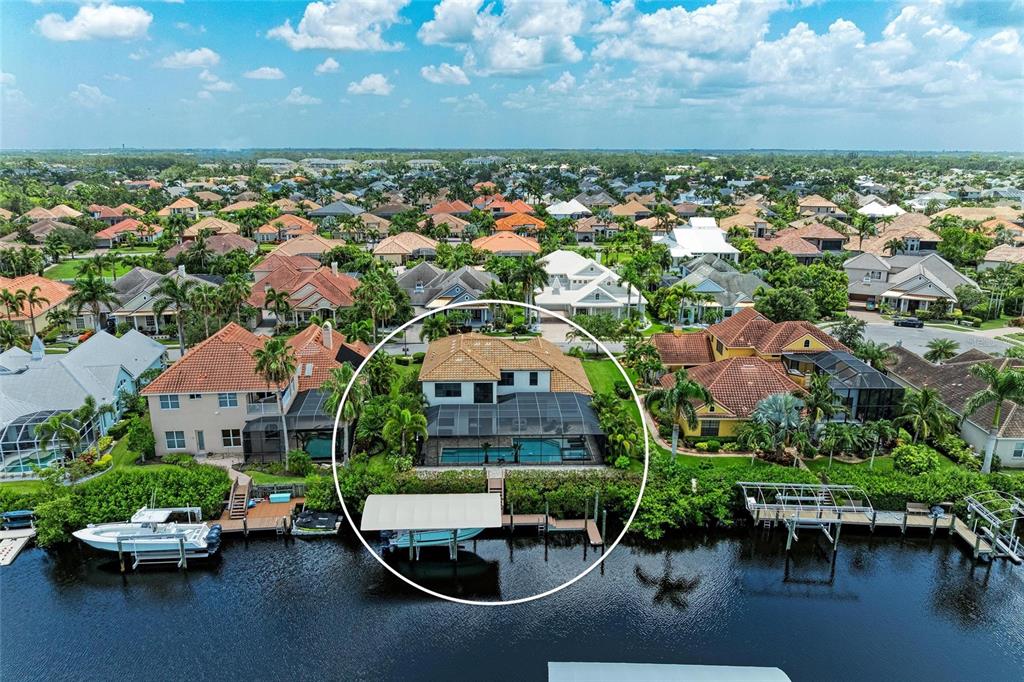 544 Fore Drive Bradenton, FL 34208 - Photo 95 of 95 an aerial view of a house with a garden and lake view