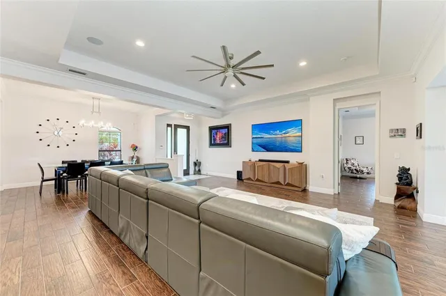 a large kitchen with a table and chairs