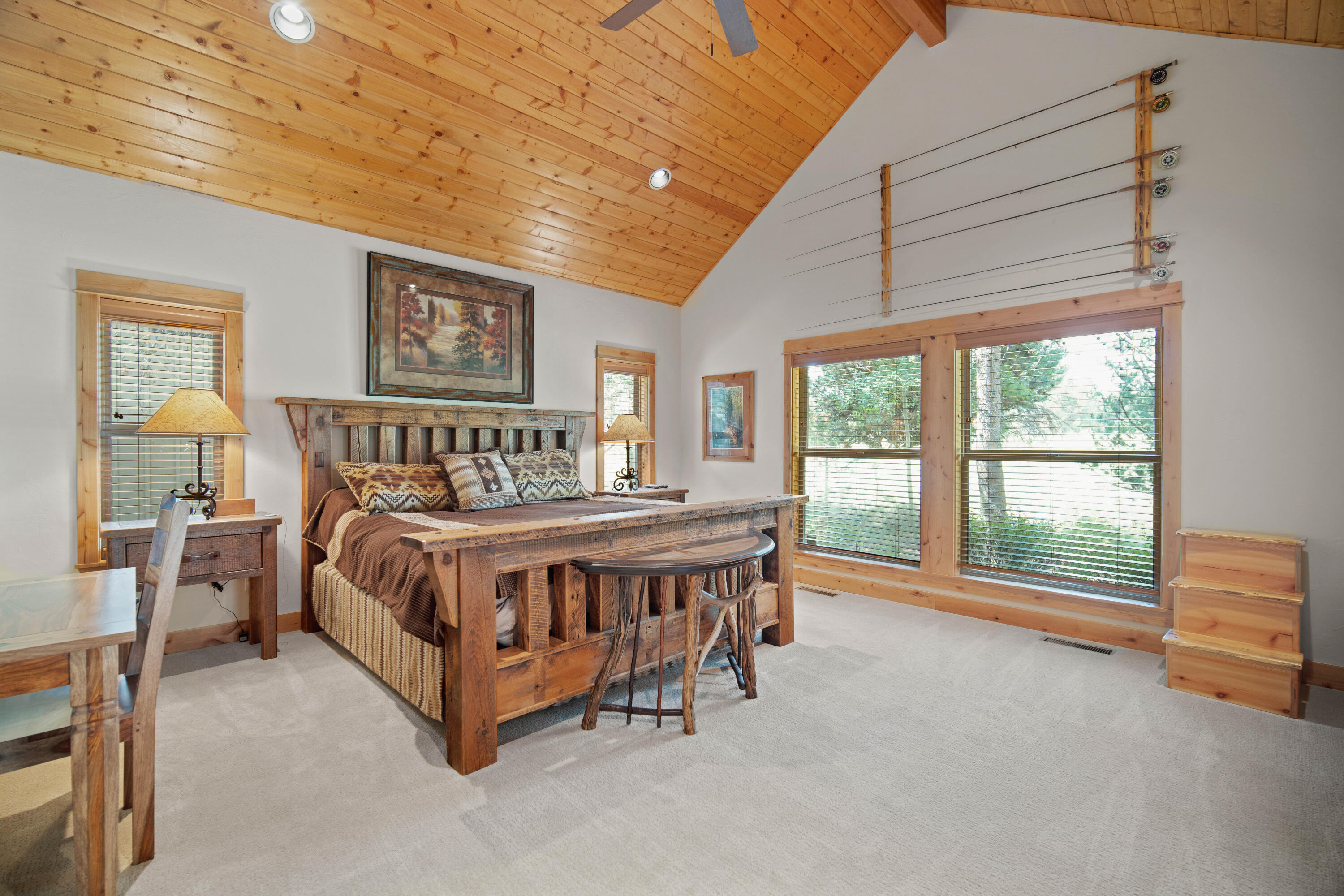 56689 Dancing Rock Loop Bend, OR 97707 - Photo 21 of 51 a bed sitting in a spacious bedroom next to a window