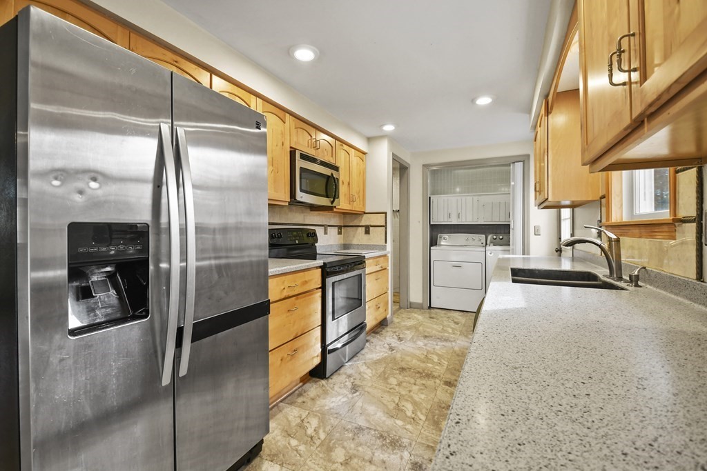 50 Perry Road Rindge, NH 03461 - Photo 12 of 36 a kitchen with stainless steel appliances granite countertop a refrigerator and a sink