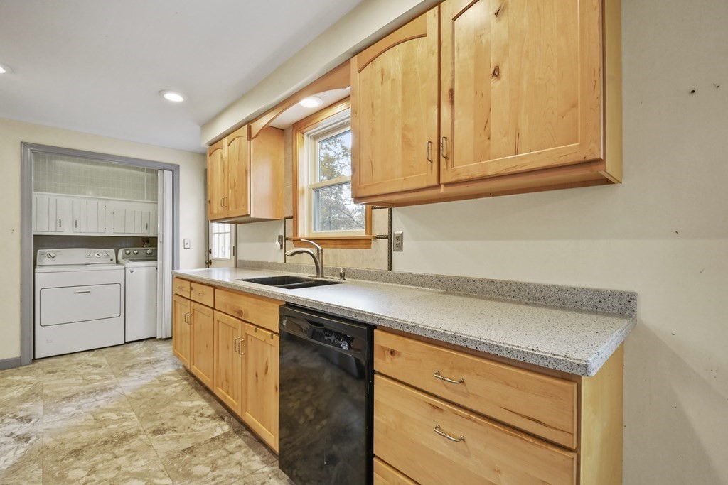 50 Perry Road Rindge, NH 03461 - Photo 13 of 36 a kitchen with stainless steel appliances granite countertop a sink dishwasher a stove and a refrigerator with cabinets