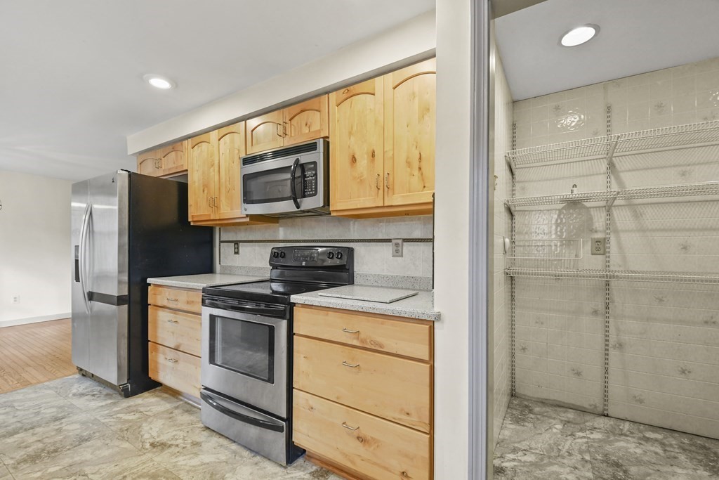 50 Perry Road Rindge, NH 03461 - Photo 15 of 36 a kitchen with a stove microwave and refrigerator