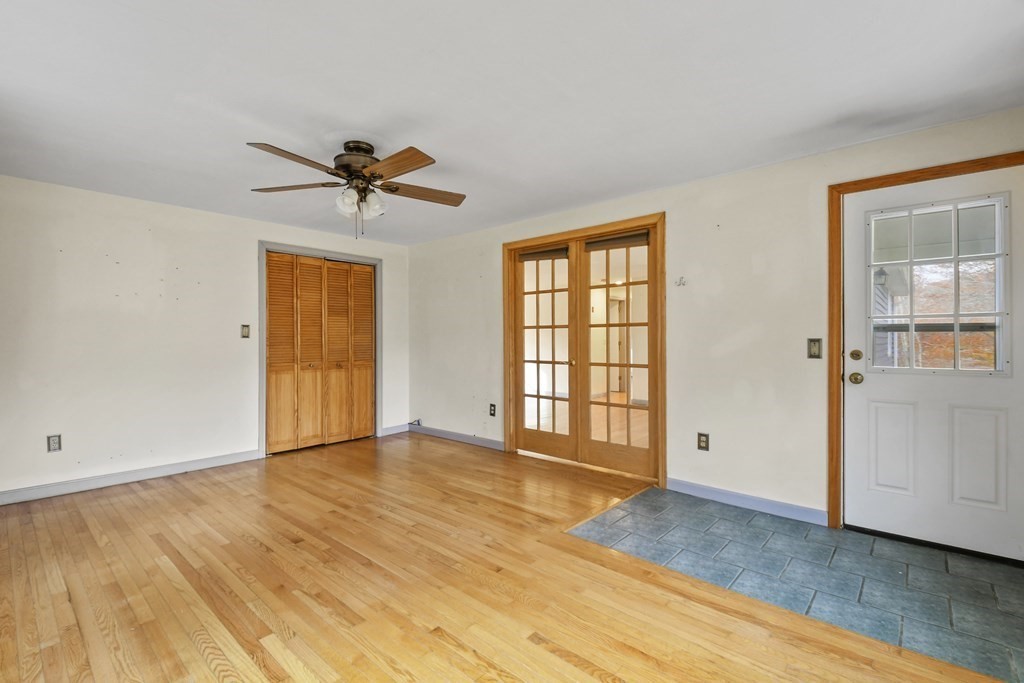 50 Perry Road Rindge, NH 03461 - Photo 18 of 36 wooden floor in an empty room with a window