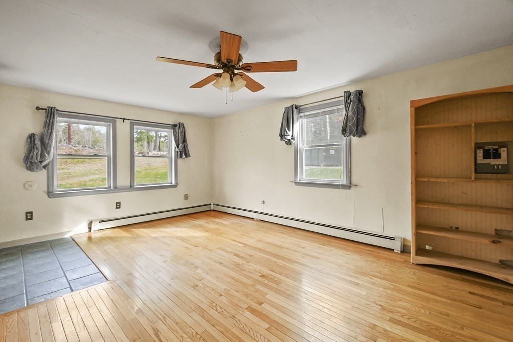 50 Perry Road Rindge, NH 03461 - Photo 20 of 36 wooden floor in an empty room with a window