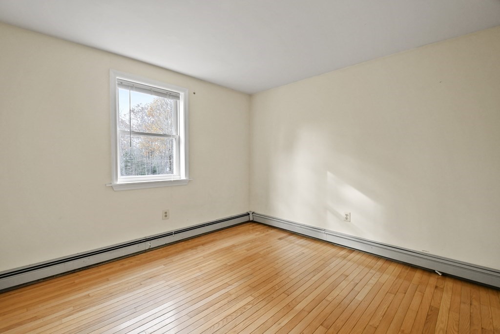 50 Perry Road Rindge, NH 03461 - Photo 22 of 36 a view of a room with wooden floor and window
