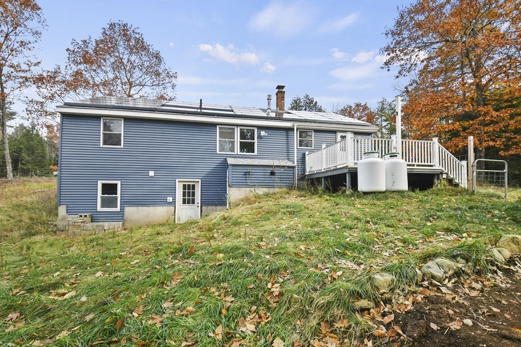 50 Perry Road Rindge, NH 03461 - Photo 32 of 36 a front view of a house with a garden