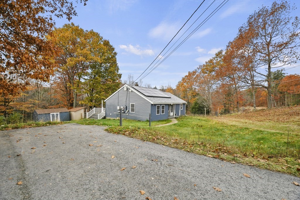 50 Perry Road Rindge, NH 03461 - Photo 34 of 36 a view of a house with a yard