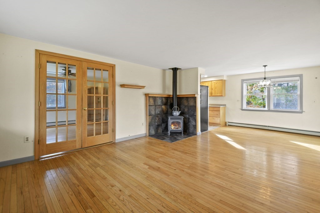 50 Perry Road Rindge, NH 03461 - Photo 5 of 36 a view of empty room with wooden floor and fan