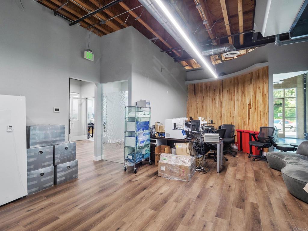 8945 Research Drive Irvine, CA 92618 - Photo 14 of 59 a living room with lots of furniture and wooden floor
