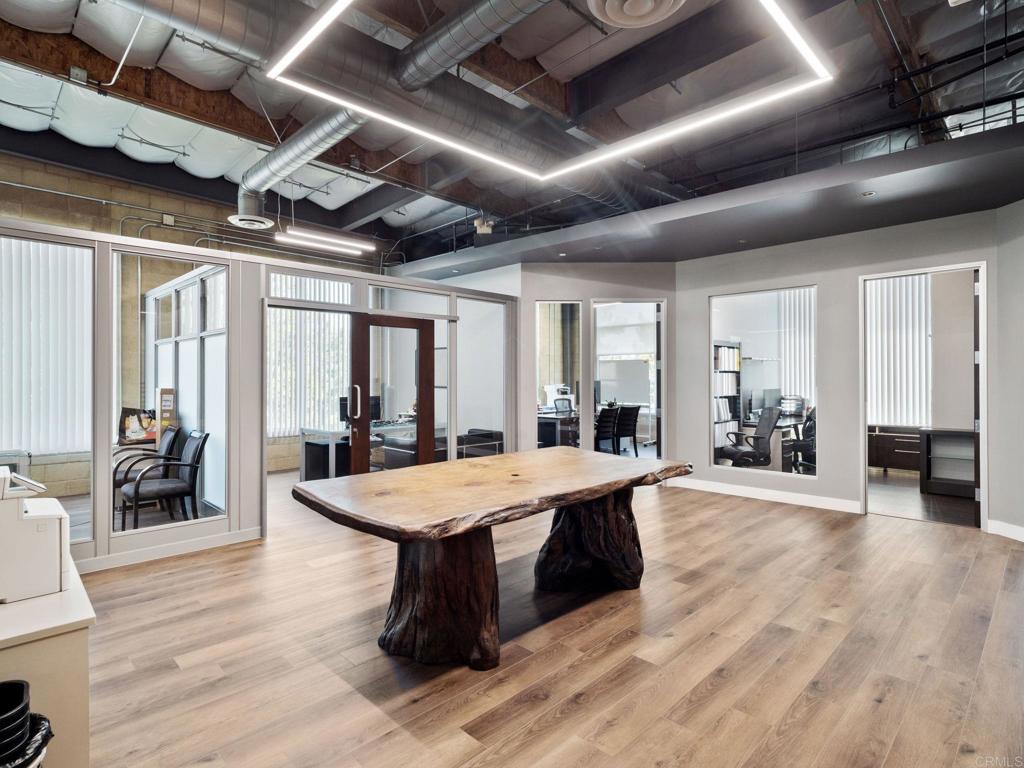 8945 Research Drive Irvine, CA 92618 - Photo 28 of 59 a dining hall with stainless steel appliances granite countertop lots of wooden furniture