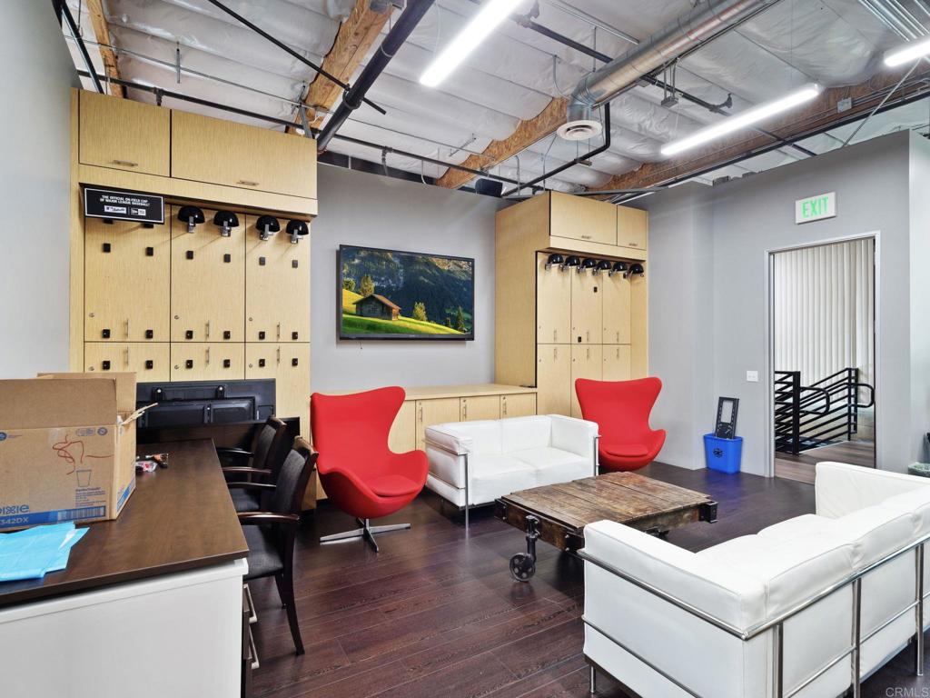 8945 Research Drive Irvine, CA 92618 - Photo 29 of 59 a living room with furniture and wooden floor
