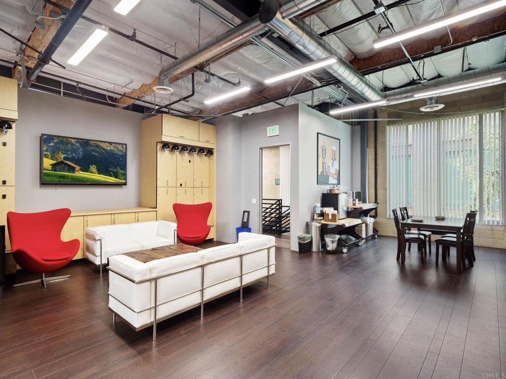 8945 Research Drive Irvine, CA 92618 - Photo 30 of 59 a living room with furniture and wooden floor
