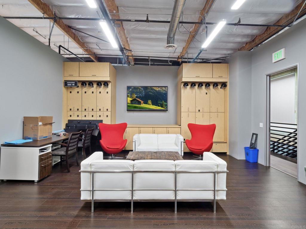 8945 Research Drive Irvine, CA 92618 - Photo 31 of 59 a living room with furniture and wooden floor