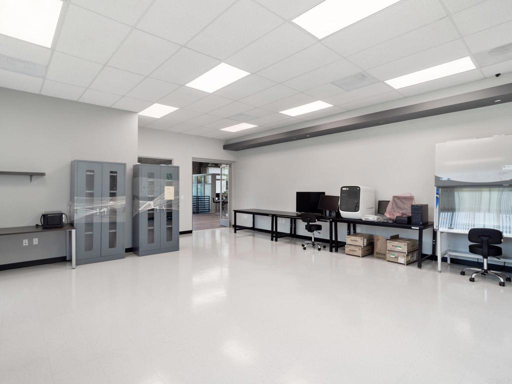 8945 Research Drive Irvine, CA 92618 - Photo 34 of 59 a living room with furniture and a large window