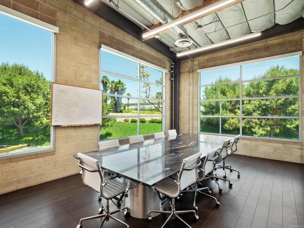 8945 Research Drive Irvine, CA 92618 - Photo 37 of 59 a view of a dining room with furniture window and wooden floor