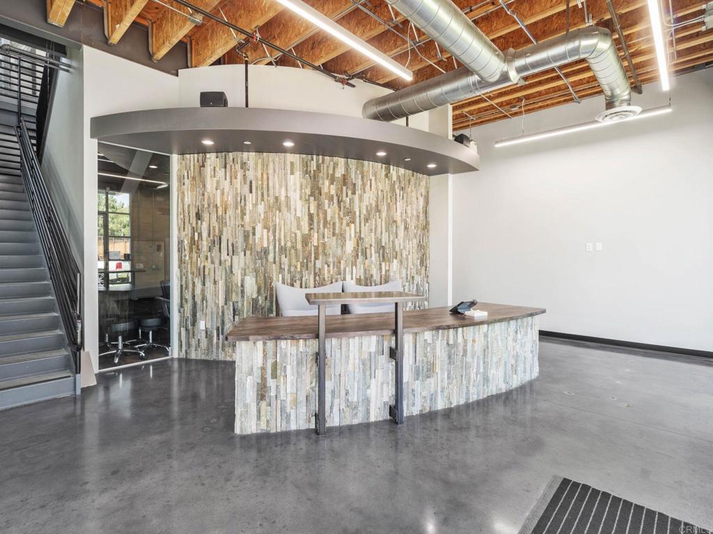 8945 Research Drive Irvine, CA 92618 - Photo 4 of 59 a living room with furniture and large windows