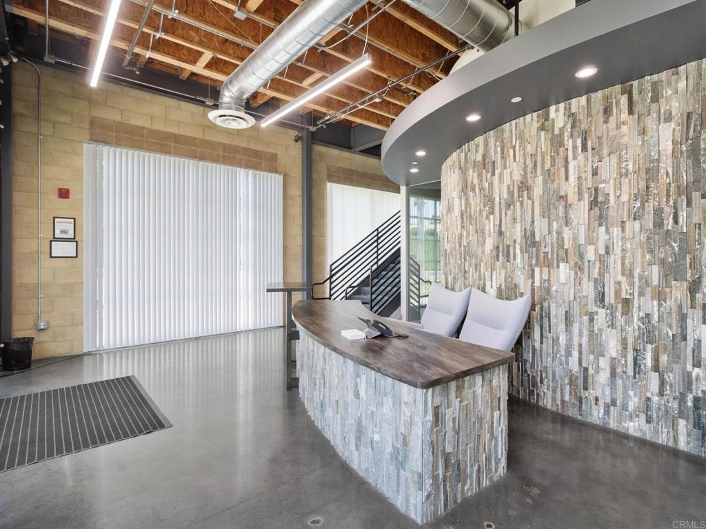 8945 Research Drive Irvine, CA 92618 - Photo 6 of 59 a living room with furniture and a rug