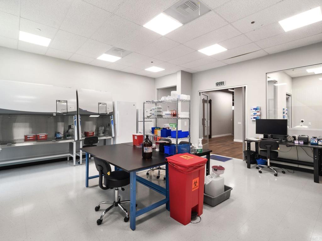 8945 Research Drive Irvine, CA 92618 - Photo 10 of 59 a room with gym equipment and stainless steel appliances