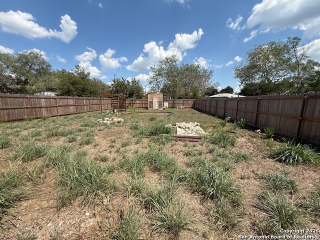 1708 Hackberry Street Three Rivers, TX 78071 - Photo 7 of 7 a view of backyard with wooden fence