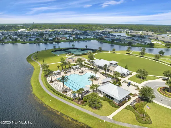 an aerial view of a house with a swimming pool