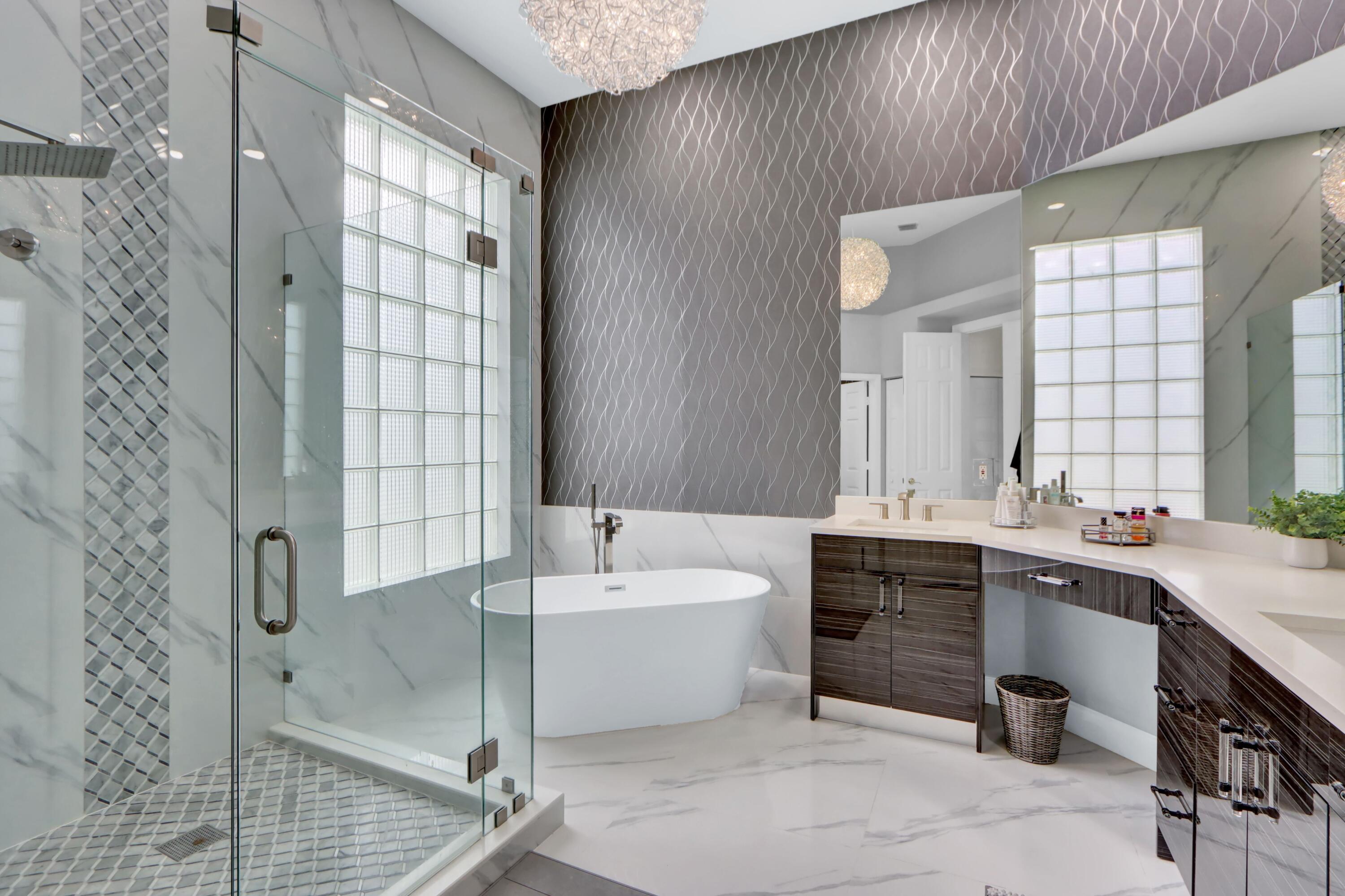6564 Somerset Circle Boca Raton, FL 33496 - Photo 11 of 39 a bathroom with a tub sink and mirror
