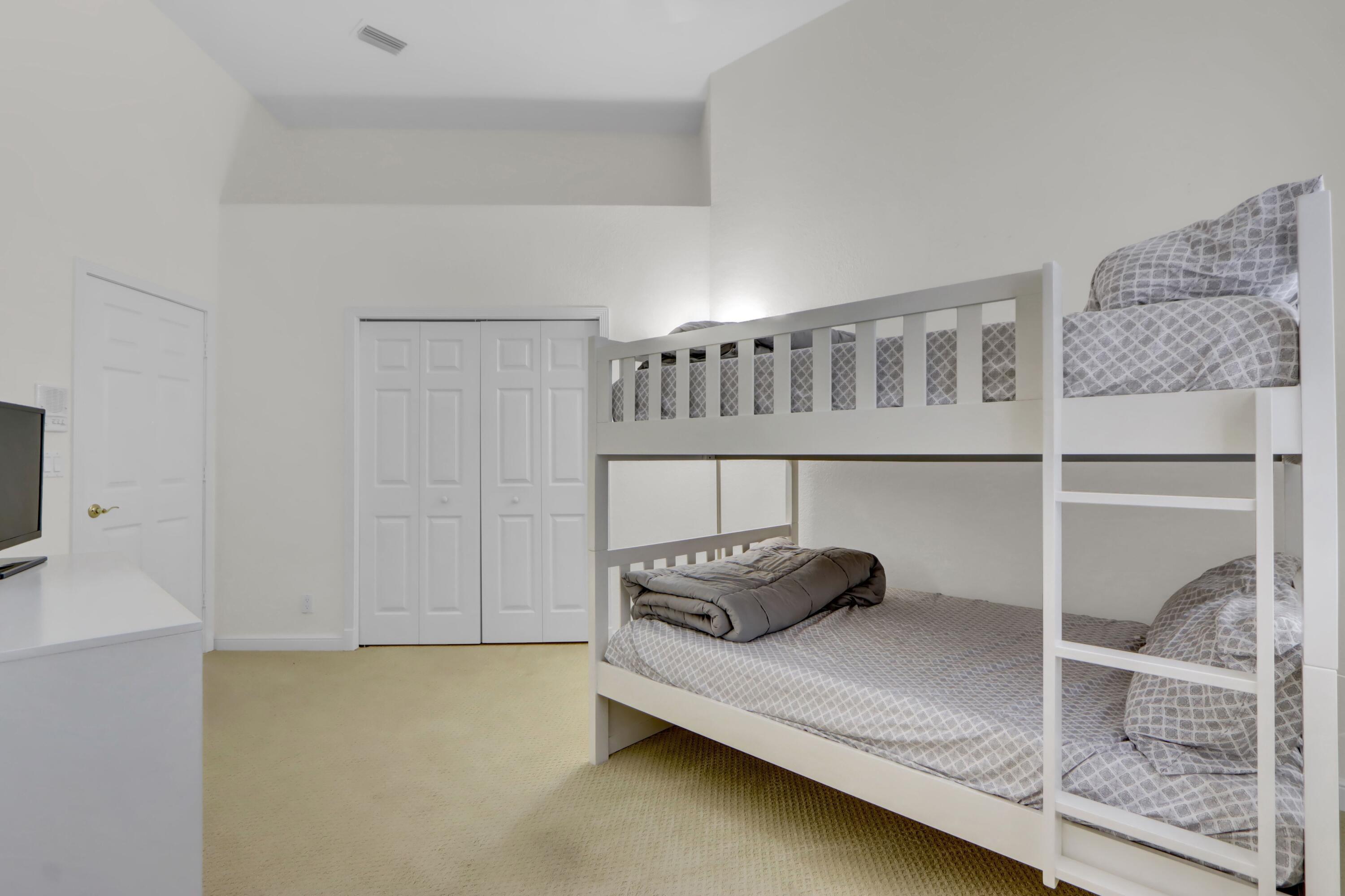 6564 Somerset Circle Boca Raton, FL 33496 - Photo 15 of 39 a bedroom with a bed and a window