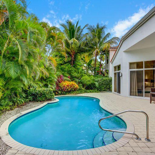 6564 Somerset Circle Boca Raton, FL 33496 - Photo 16 of 39 a view of a swimming pool with an outdoor space