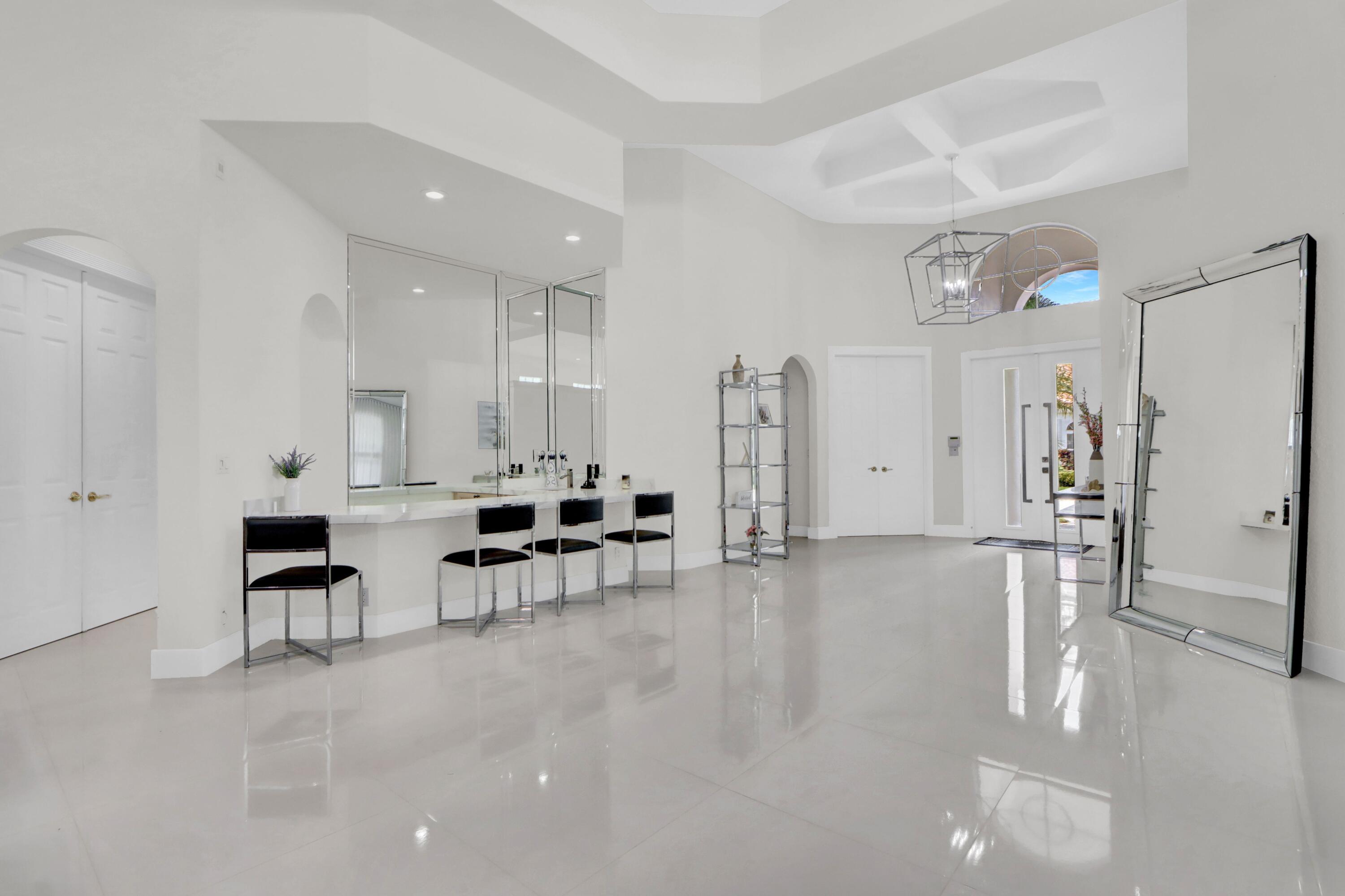 6564 Somerset Circle Boca Raton, FL 33496 - Photo 2 of 39 a large white kitchen with furniture and a refrigerator