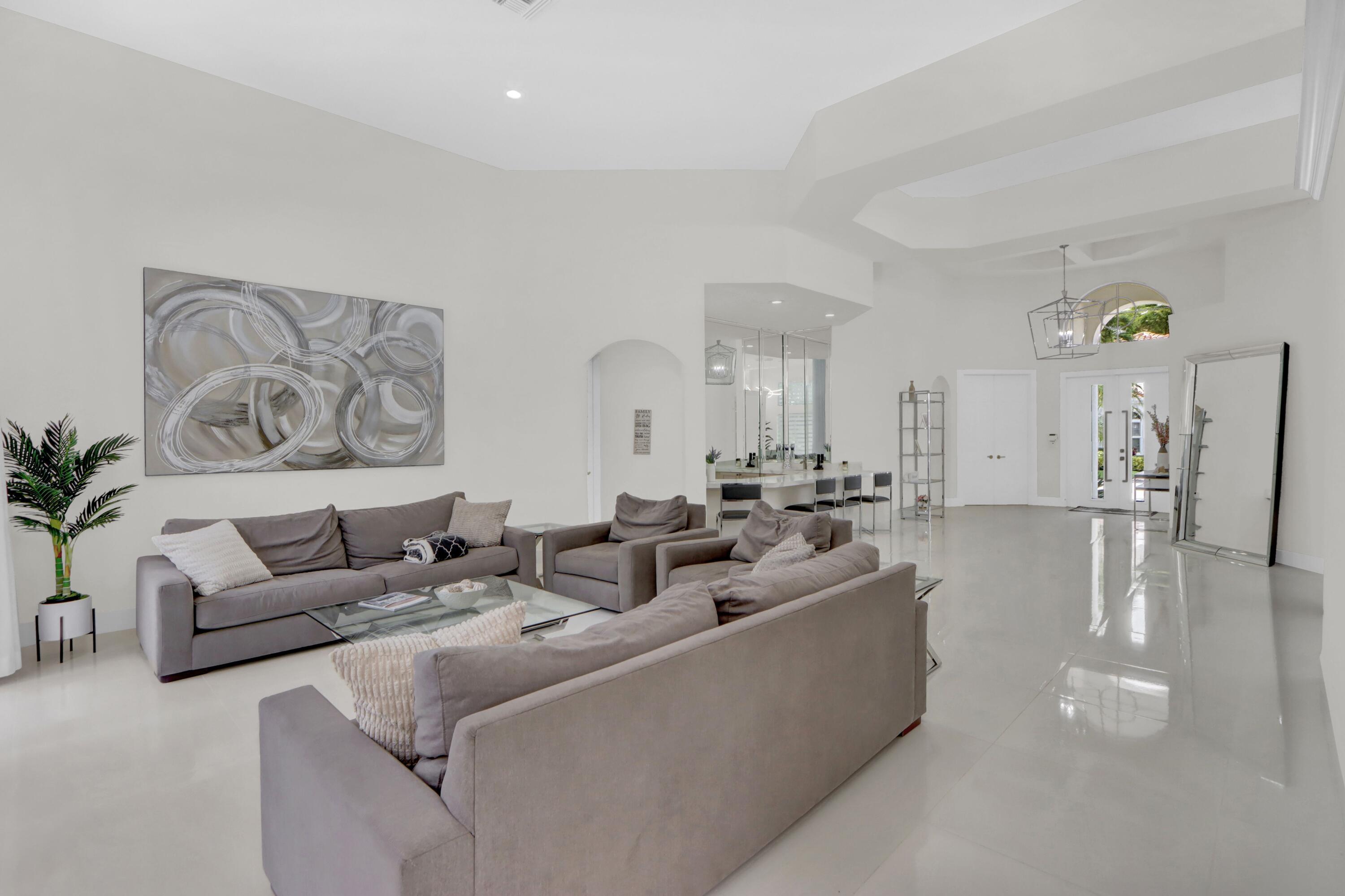 6564 Somerset Circle Boca Raton, FL 33496 - Photo 3 of 39 a living room with furniture and a large window