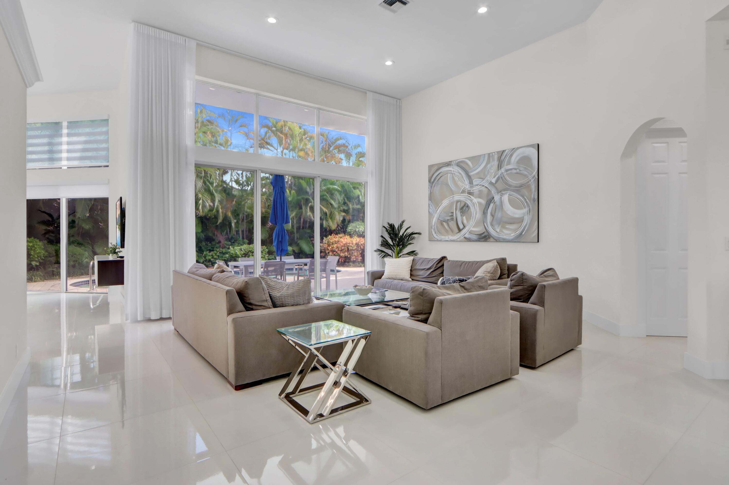 6564 Somerset Circle Boca Raton, FL 33496 - Photo 4 of 39 a living room with furniture and a large window