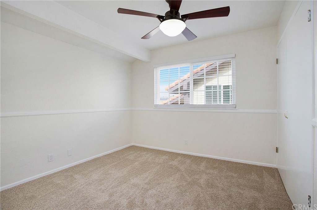 15832 Monroe Street Westminster, CA 92683 - Photo 19 of 32 an empty room with a window and a fan