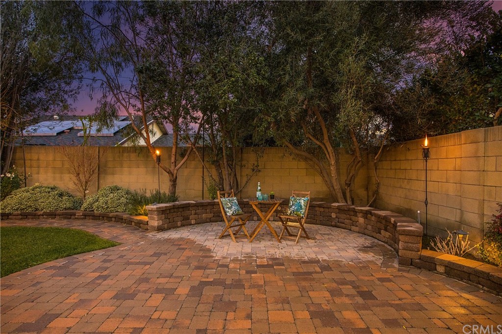15832 Monroe Street Westminster, CA 92683 - Photo 22 of 32 a backyard of a house with table and chairs