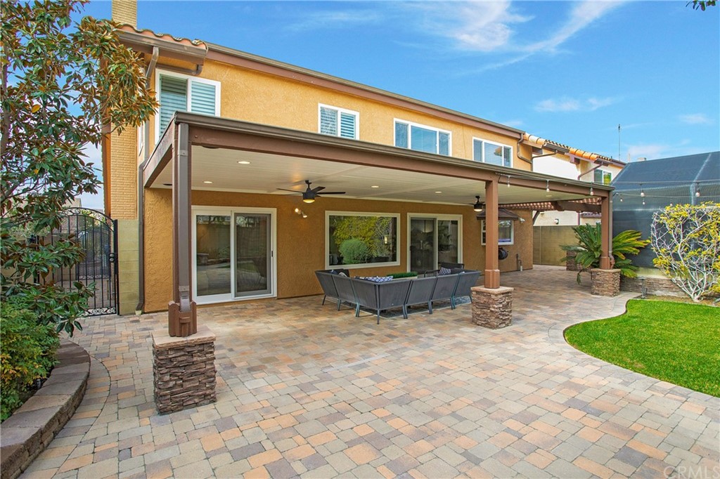 15832 Monroe Street Westminster, CA 92683 - Photo 31 of 32 a view of a house with backyard sitting area and porch