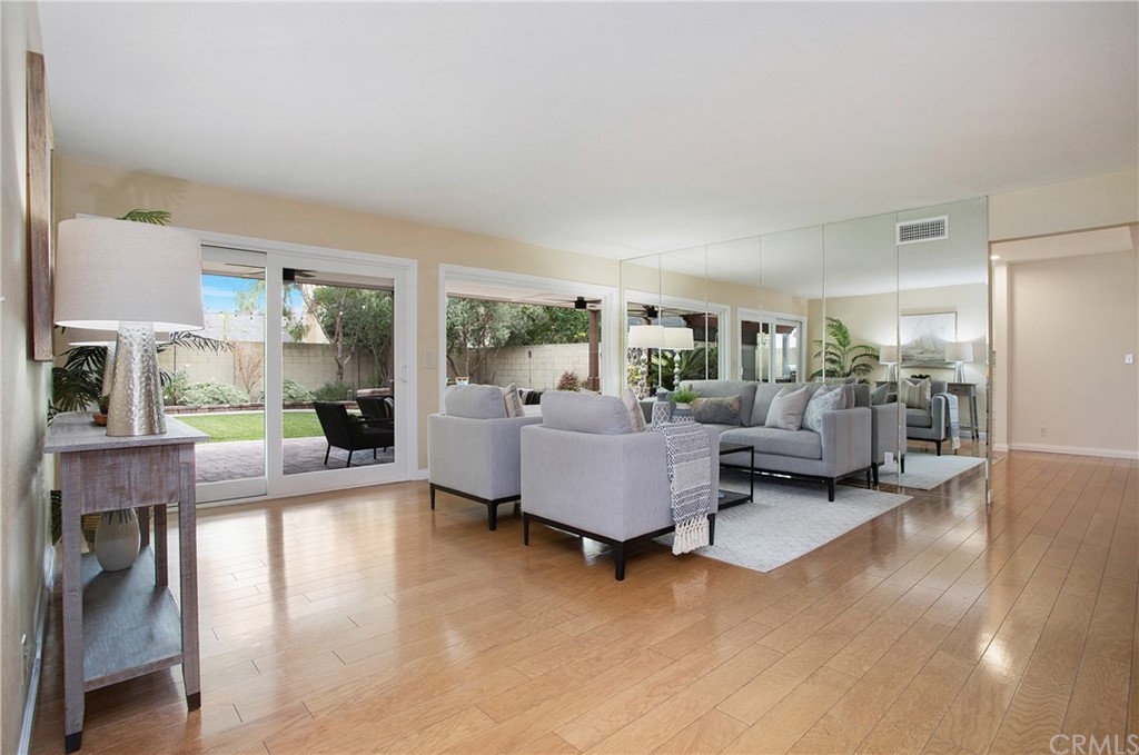 15832 Monroe Street Westminster, CA 92683 - Photo 8 of 32 a living room with furniture and a wooden floor
