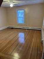 7 Hillside Avenue, Unit 2 Everett, MA 02149 - Photo 8 of 14 a view of a room with wooden floor and window