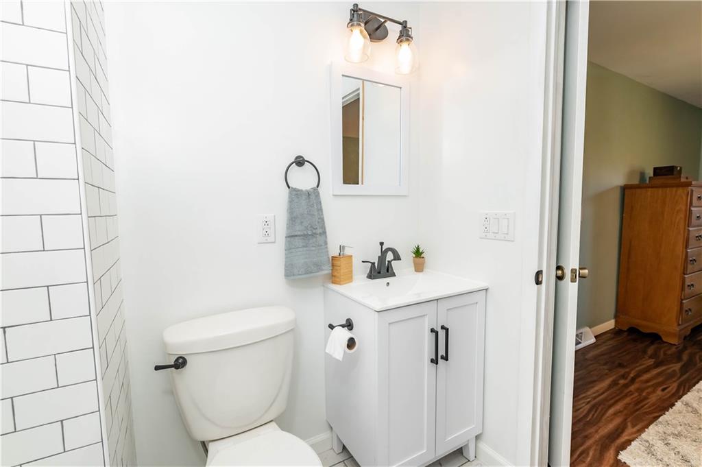 2555 Morrow Road Home, PA 15747 - Photo 11 of 24 a bathroom with a toilet sink and vanity