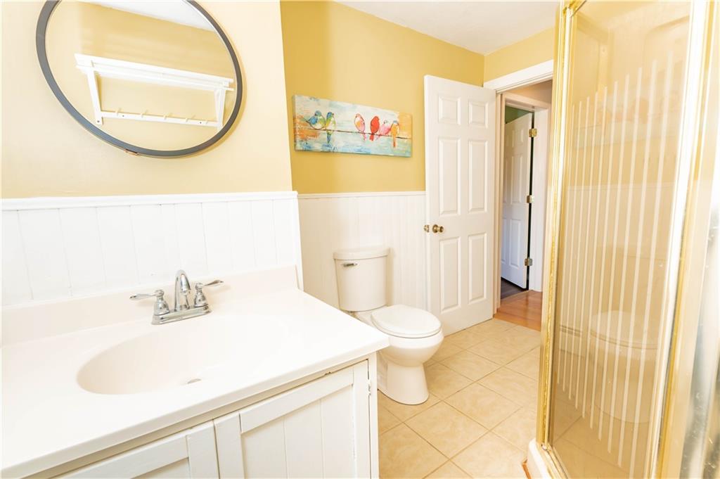 2555 Morrow Road Home, PA 15747 - Photo 14 of 24 a bathroom with a sink a toilet and a mirror